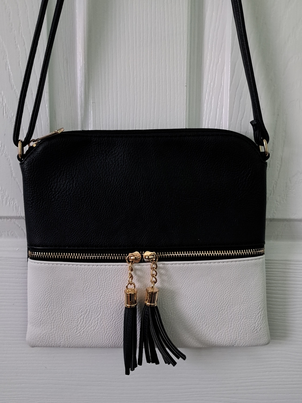 Black & White Two-Tone Crossbody Bag with Tassel Accent